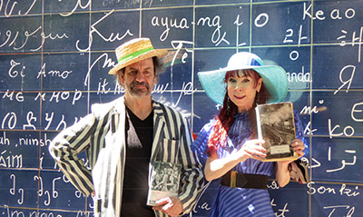 Poet Jack Cooper and MariaD’Arcy in front of the “Love wall” in Montmartre.